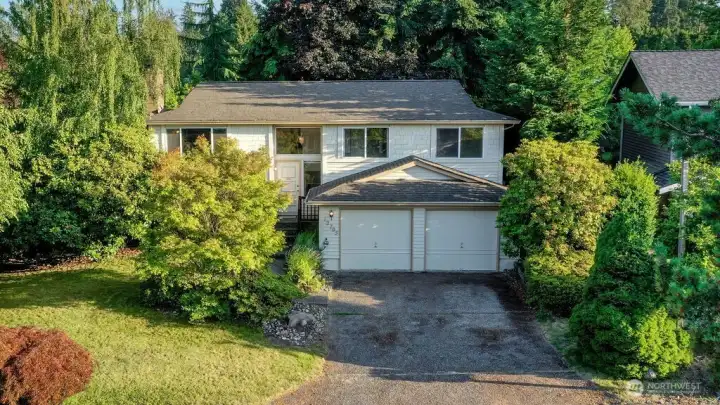 Well maintained home on spacious lush lot with mature landscaping.