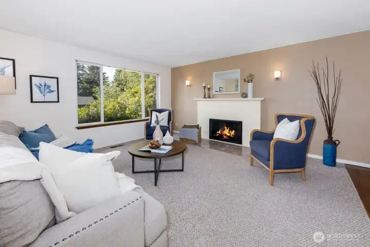 Wood burning fireplace. The living enjoys a bird's eye view of the neighborhood.