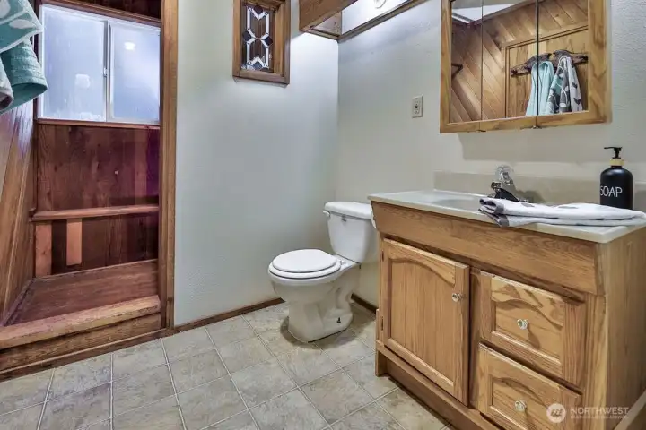 Unique 3/4 bath with wood shower and sauna.