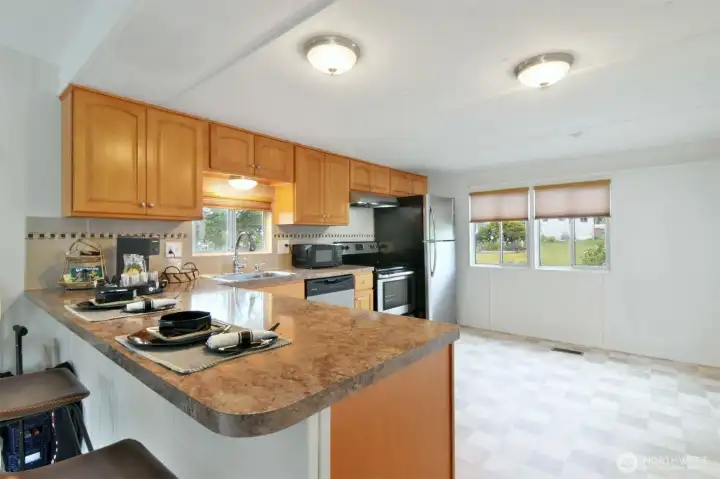 Counter seating plus plenty of room to put a breakfast table. Counter seating plus plenty of room to put a breakfast table.