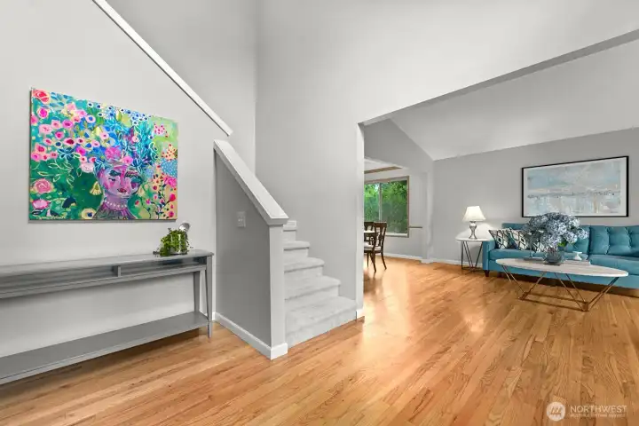 Entry with beautiful hardwood floors throughout entry, living and formal dining room.