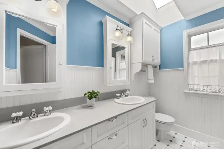 Updated full bathroom on the upper level with dual vanities