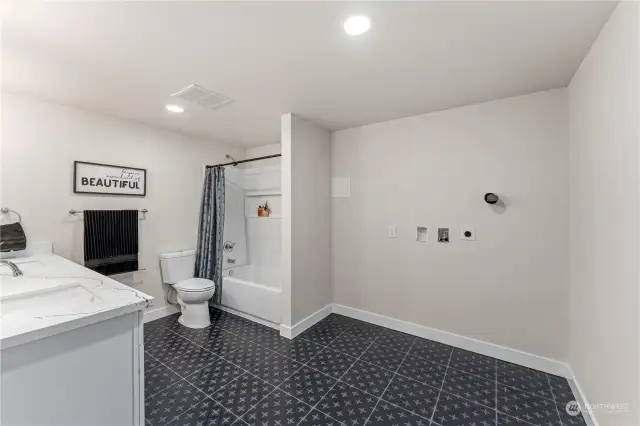 Lower level bathroom w/ laundry