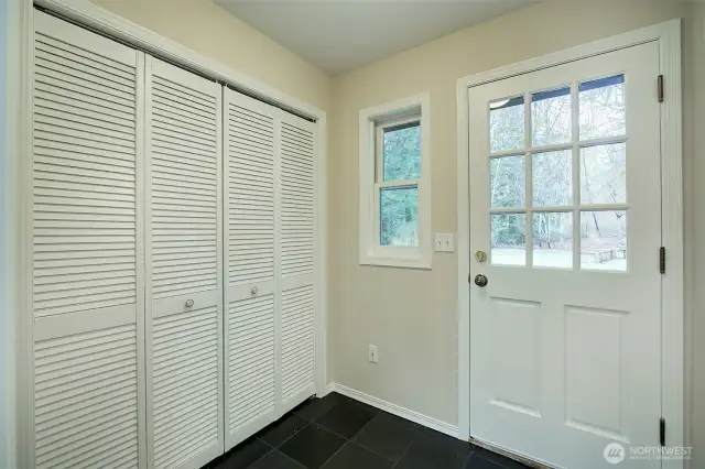 Studio has a front and back entry with a large mudroom and closet