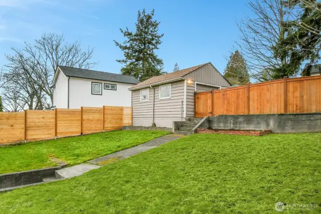 Large backyard with so many possibilities. The alley behind extends street to street.