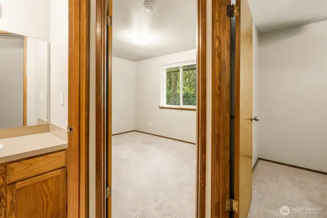 Hallway view of the two guest bedrooms and guest bathroom.