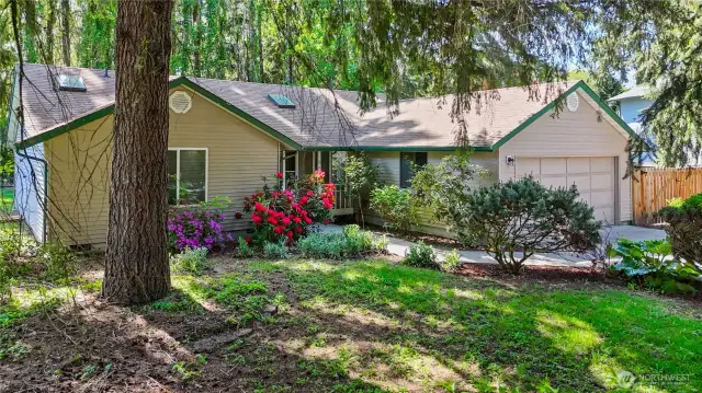 Mature front landscaping with springtime florals.