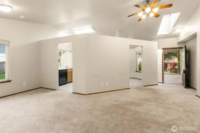 Soaring ceilings with skylights grace the Living room.