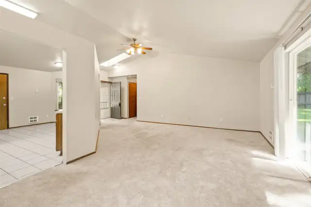 Carpets have been professionally cleaned. Living room wraps the Kitchen. Slider leads out to patio in fully fenced yard.