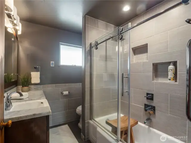 Remodeled main floor bath w/heated tile flooring.