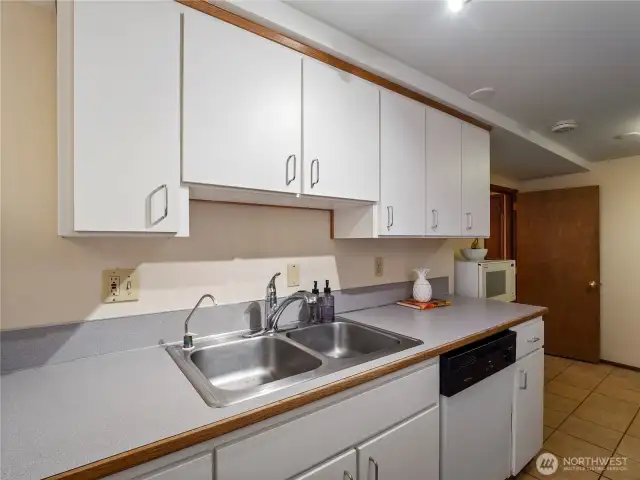 All appliances included in the lower level kitchenette; stove/range, refrigerator, dishwasher.