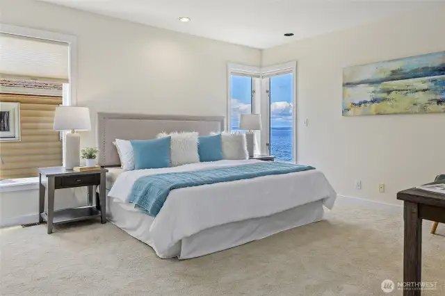 Primary bedroom with a lovely view on main level.