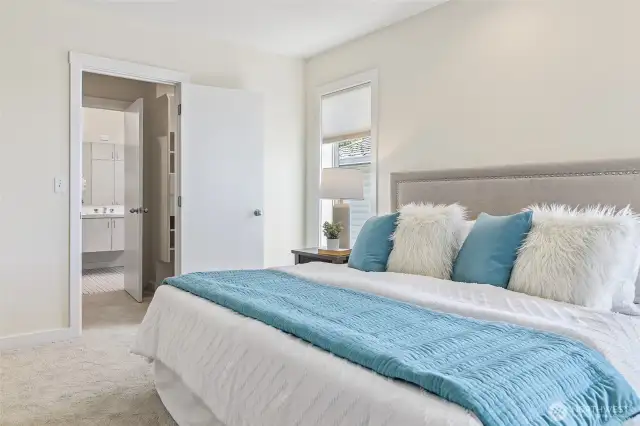 Spacious primary bedroom w/ensuite bath.