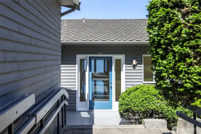 Approach to the home with garage alongside.