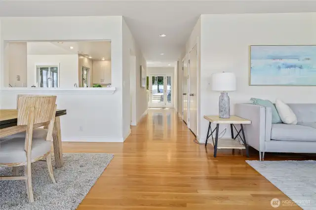 A view of the entry door from the living room and dining room.