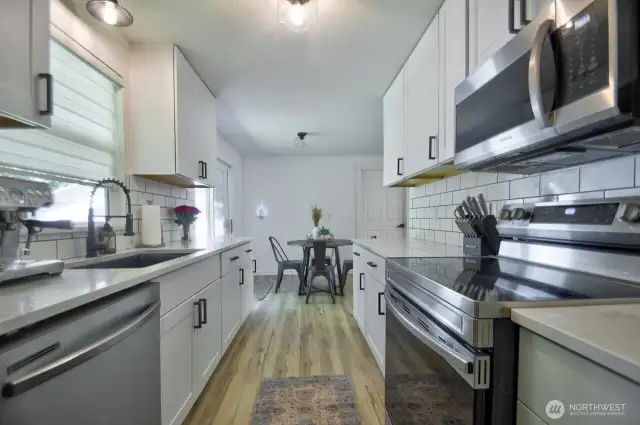Galley style kitchen looking toward eating nook