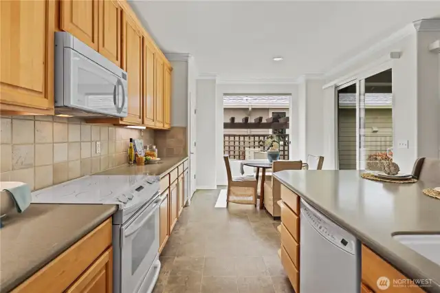 GE appliances throughout the kitchen with Corian countertops