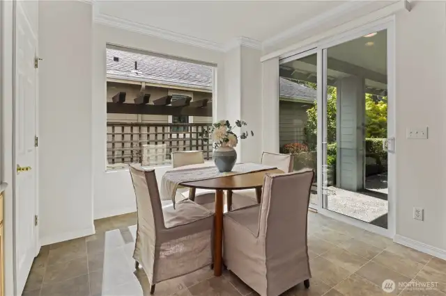 Enjoy afternoon tea with an abundance of natural light and access to the covered patio.