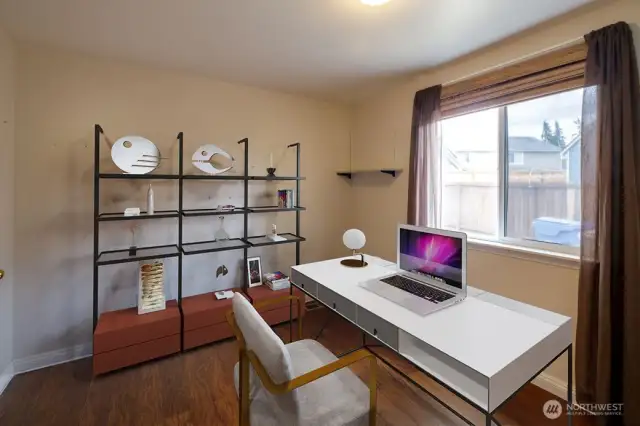 Main floor den/office virtually staged.