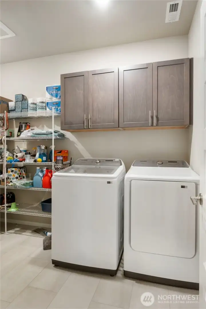 large extended laundry room with storage to the left