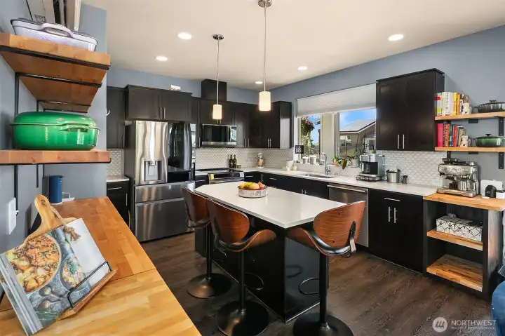 Gorgeous chef's kitchen features new LG smart appliances (refrigerator, induction stove and microwave).