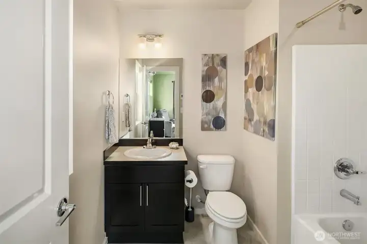 First level full bath. Yes, all three bedrooms have their own bathroom!