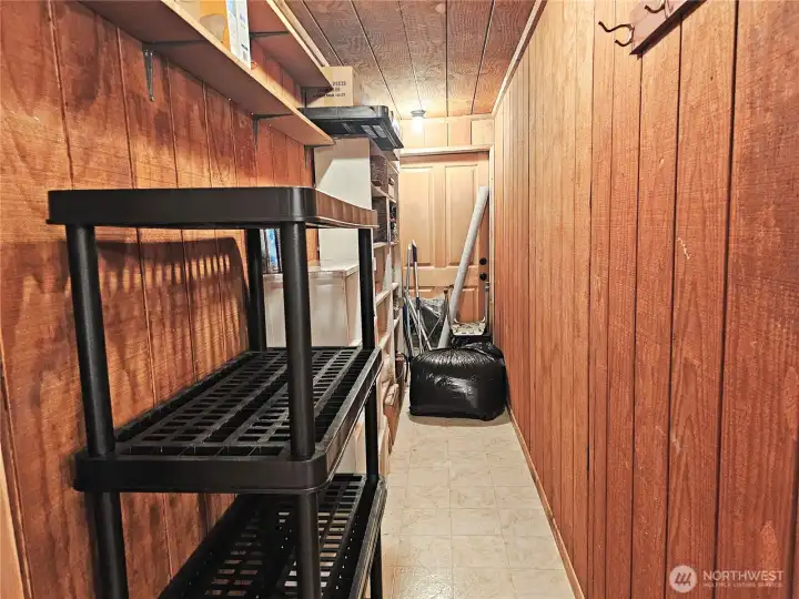 The door at the back of the walk in pantry leads into the solarium.