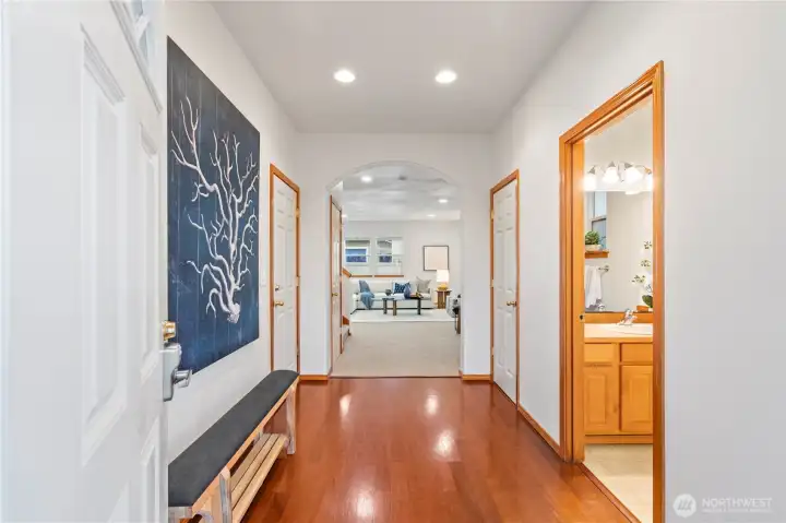 Step inside to a welcoming spacious foyer with warm Brazilian cherrywood flooring that glides you to the main living spaces. Classic wood trims and arched doorways add to the charm of this craftsman gem.