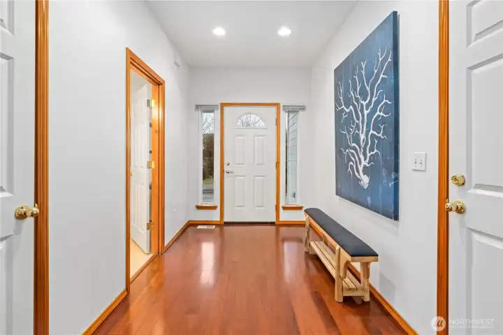 Another view of the foyer shows the main floor powder room to the left of the front entrance.