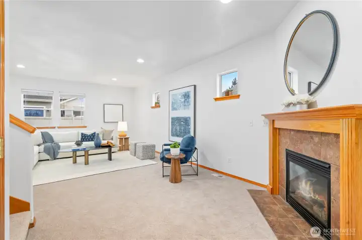 Step right into this bright and inviting living space accented with a tiled surround wooden mantle gas fireplace, creating a cozy and comforting ambiance. Fresh interior paint and plush carpeting throughout home.