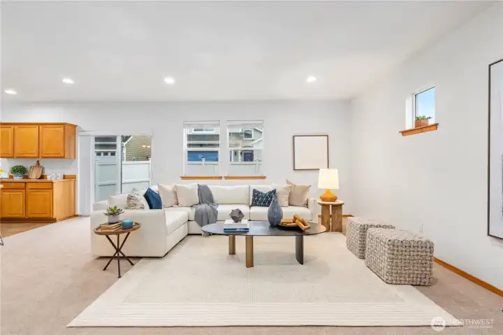 The cozy and relaxing living space illuminated by the dual walls of windows for optimal natural light. Fresh interior paint and plush new carpeting throughout the home makes for such an inviting welcome.