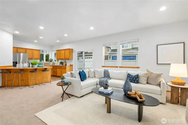 The airy and open floor plan creates an effortless transition with clear sight lines from the living area to the kitchen.