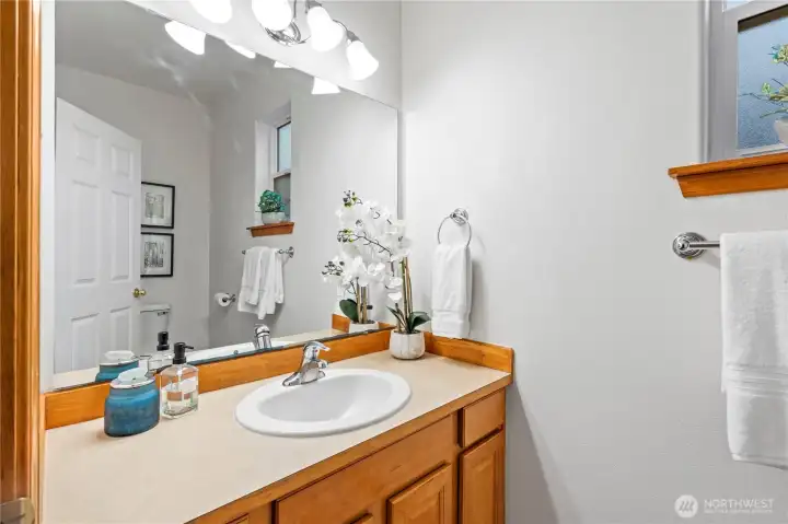 Convenient main floor powder room discreetly located right off the front entrance.