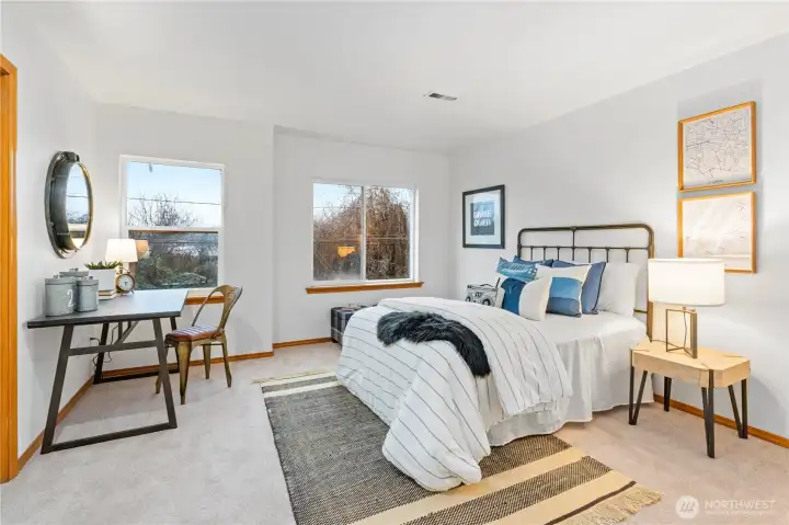 Bedroom #1 with eastern exposure receives optimal warm morning sunlight with the wall of dual windows. This sizable room can easily accommodate a king-sized bed and other large furnishings.