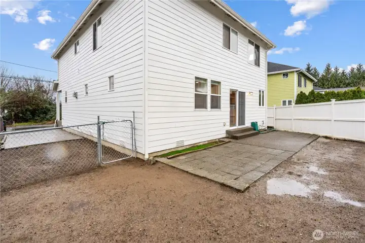 Fully-fenced low maintenance backyard with newly stained fencing and extended patio space for outdoor enjoyment. Fresh exterior paint.