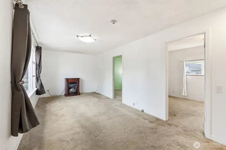 Spacious living room. Seller heated with the fireplace.