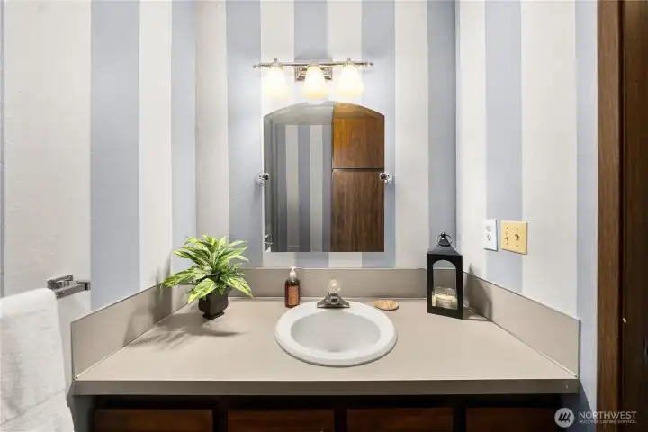 The powder bathroom is large and accessible on the main floor.