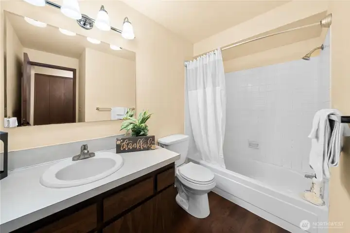 The primary bathroom is comfortable and nicely sized.