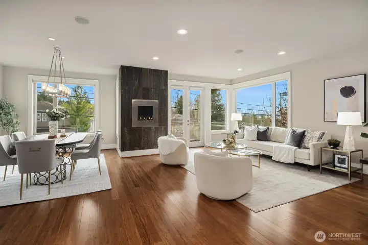 Bight, open great room seamlessly integrates the dining, family room and kitchen