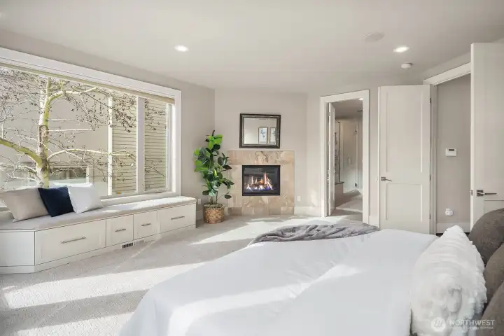 Gas fireplace turns cools nights cozy. Built-in window seat offers additional storage space