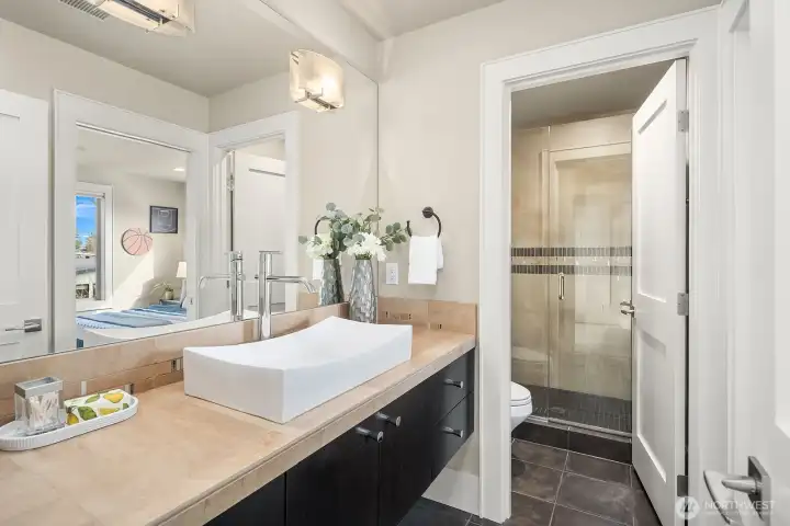 This 3/4 bath can be accessed from the bedroom or living space
