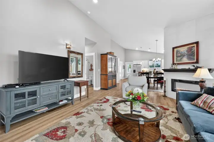 Valted Ceilings, Electric Fireplace, beautiful flooring throughout, built in wall sconces, upgraded light fixtures.