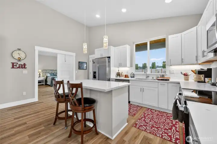 Large kitchen island, all modern appliances. Light fixtures above the kitchen island have internal battery offerring light during power outages.