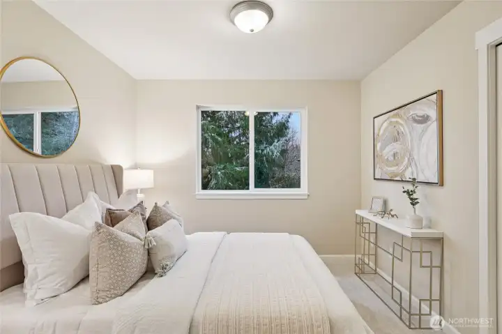 Guest room with custom shelving in closet.