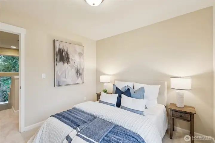 Bedroom with custom shelving in the walk in closet.