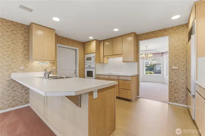 Kitchen looking towards front dining room and garage entrance
