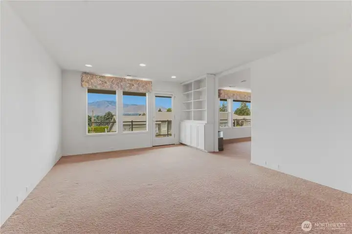 Den off of living room and access to deck.