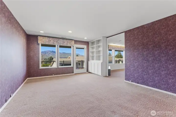 Den off of living room and access to deck.