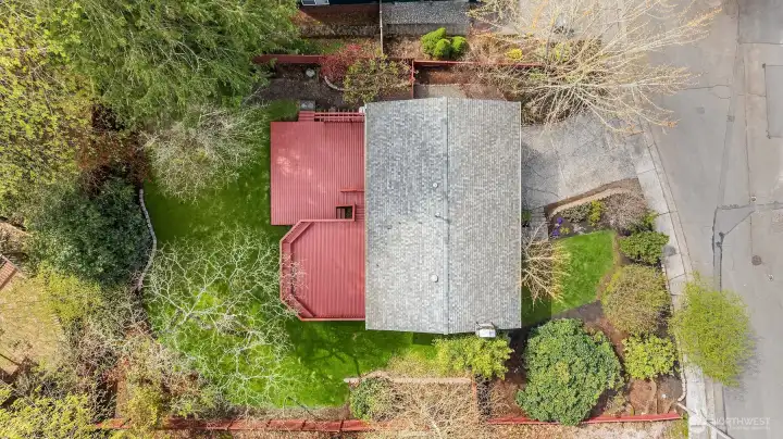 Fully fenced back yard and mature landscaping this yard space is dreamy and feels private