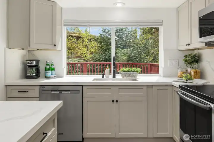 Dishes with a view!! Keep an eye on the backyard easily from the kitchen as your 2 or 4 legged friends play